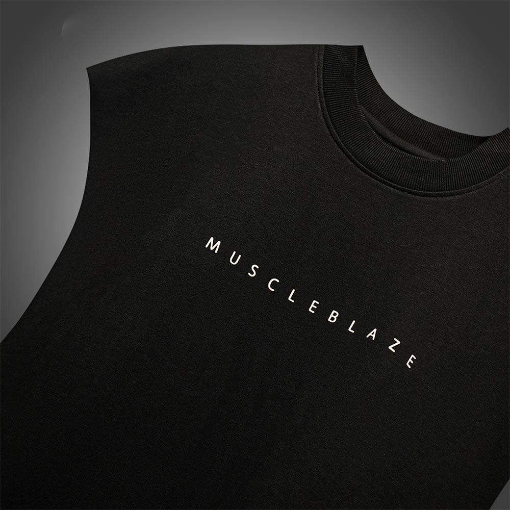 https://img2.hkrtcdn.com/40806/prd_4080591-MuscleBlaze-B.D.S.M-Oversized-Tank-Medium-Black_o.jpg