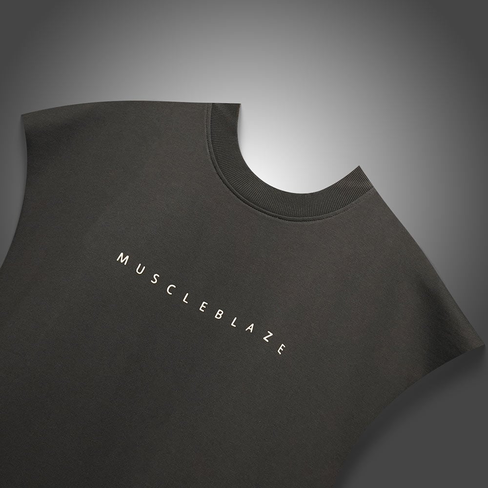 https://img2.hkrtcdn.com/40807/prd_4080621-MuscleBlaze-B.D.S.M-Oversized-Tank-Medium-Charcoal_o.jpg